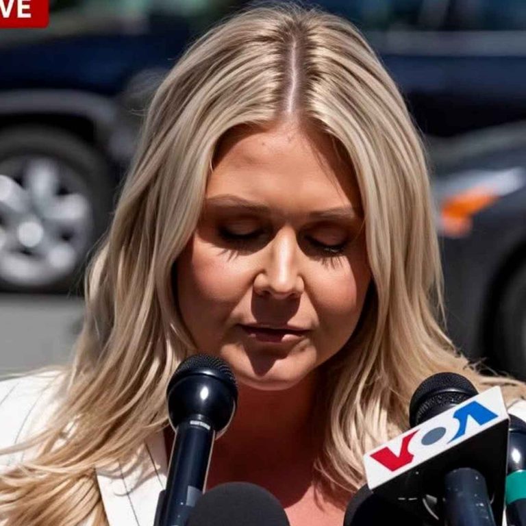 blonde woman speaking at press conference